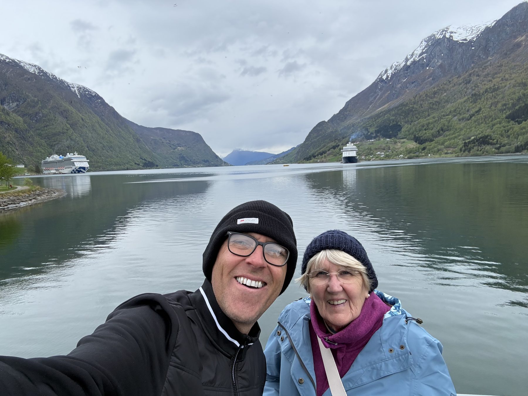 Frances by the fjord with two cruise ships