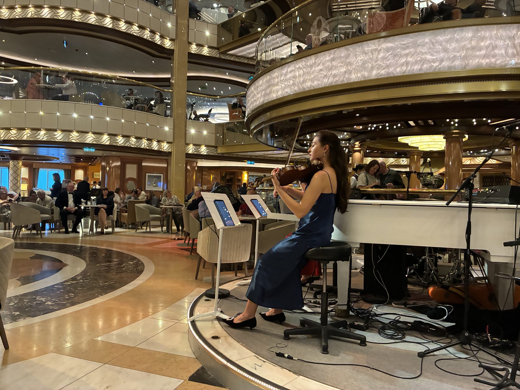 A violinist playing in the Piazza atrium