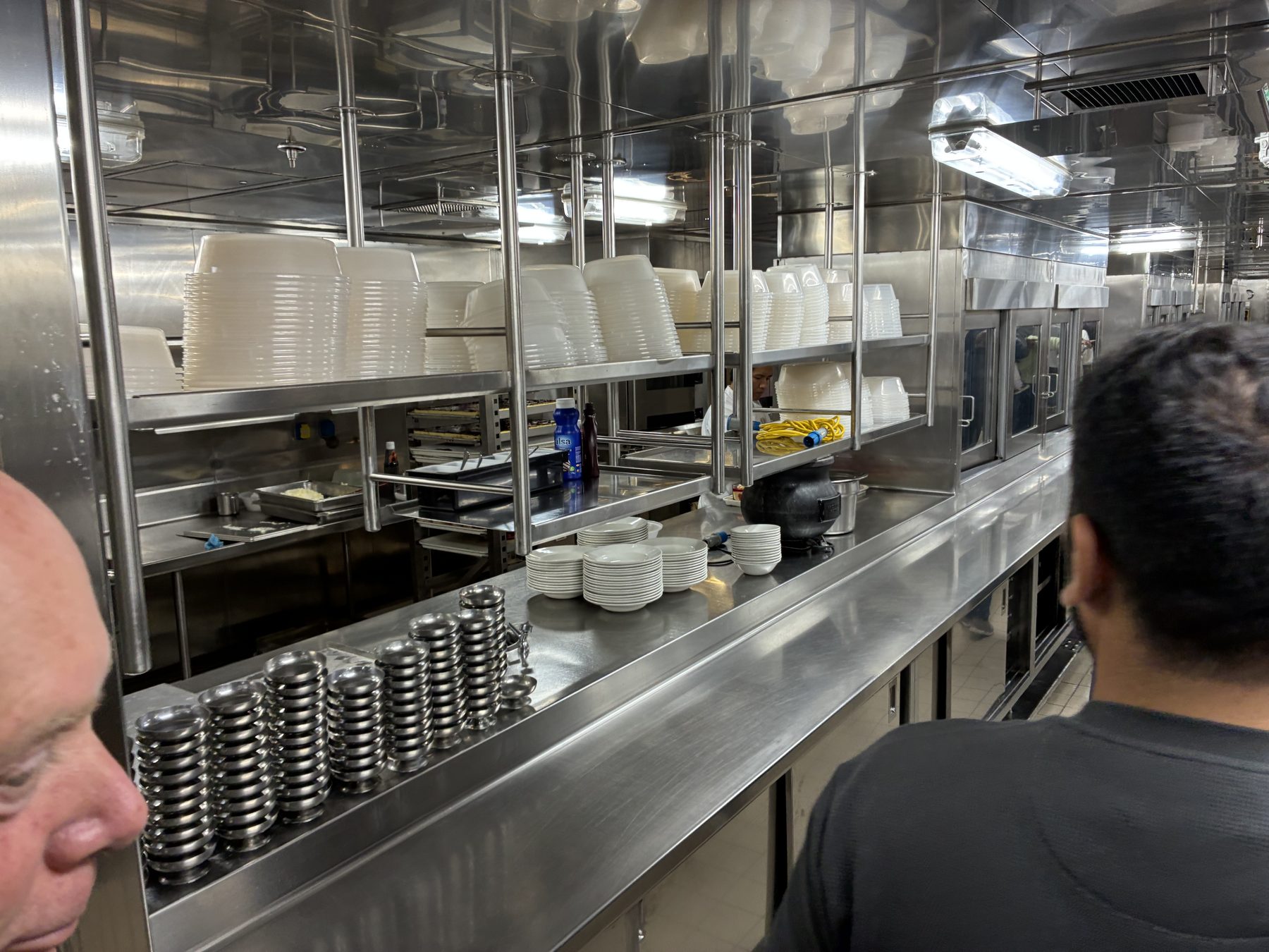 The pass area in the galley with stacks of bowls