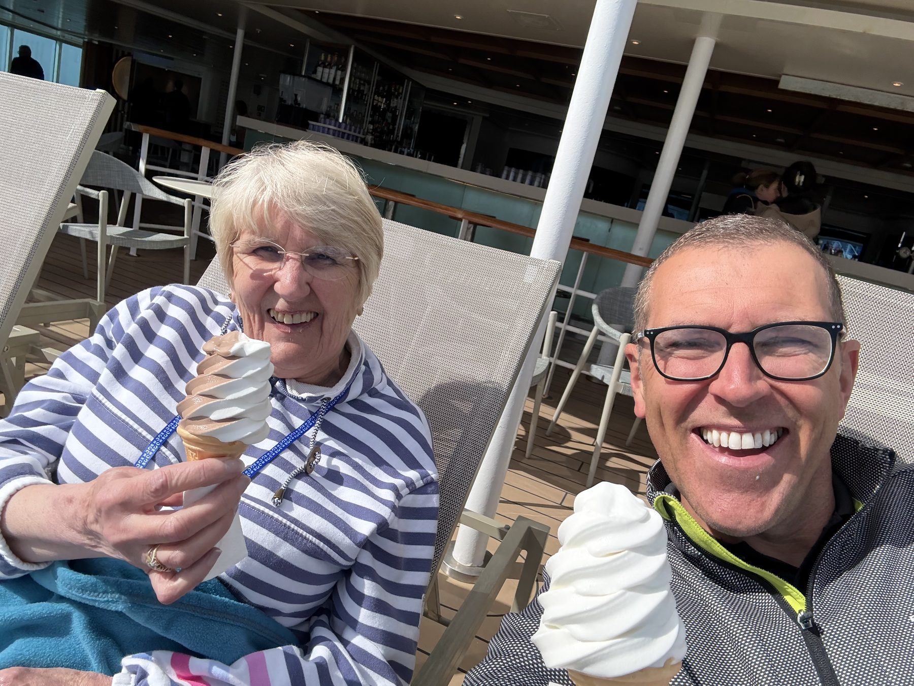 Frances and Stuart on deck with ice creams in the sun